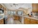 Bright kitchen with modern appliances and an adjacent breakfast nook at 92 Tall Trees Ct, Sarasota, FL 34232