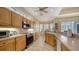 Bright kitchen with stainless steel appliances, light wood cabinetry, and tiled flooring at 92 Tall Trees Ct, Sarasota, FL 34232