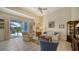 Inviting living room with tile floors, neutral tones, and access to the outdoor patio at 92 Tall Trees Ct, Sarasota, FL 34232