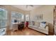 Bright office with a large window, desk, comfortable seating, and hardwood floors at 92 Tall Trees Ct, Sarasota, FL 34232