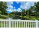 Enjoy the scenic view of the lush pond from the community area, creating a peaceful retreat at 92 Tall Trees Ct, Sarasota, FL 34232