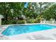 Take a dip in the community pool surrounded by lush landscaping, offering a relaxing and private atmosphere at 92 Tall Trees Ct, Sarasota, FL 34232