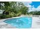 Community pool offers a refreshing escape with lush tropical landscaping and a serene environment at 92 Tall Trees Ct, Sarasota, FL 34232