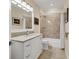 Bathroom featuring a single sink, granite countertops, tiled floors, and shower over tub at 1359 Tearose Pl, Sarasota, FL 34239