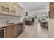 Stylish kitchen and bar area with granite counters, stainless steel appliances, and ample storage space at 1359 Tearose Pl, Sarasota, FL 34239