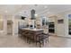Spacious kitchen with large center island, breakfast bar, stainless steel appliances, and ample counter space at 1359 Tearose Pl, Sarasota, FL 34239