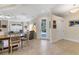Bright living area with tile flooring, neutral paint, and a view of the outdoor space through a glass door at 1359 Tearose Pl, Sarasota, FL 34239