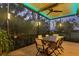 Screened-in patio with a dining table and chairs, offering a relaxing space for outdoor meals at 1359 Tearose Pl, Sarasota, FL 34239