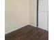 A cozy bedroom featuring laminate flooring and a sliding door closet at 1873 University Pl # 135, Sarasota, FL 34235