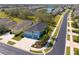 Desirable community offering serene living, showcasing a beautiful lake view and tree-lined street at 2006 Red Lake Run, Bradenton, FL 34211