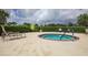 Community hot tub surrounded by lush landscaping, offering a private and relaxing retreat at 2006 Red Lake Run, Bradenton, FL 34211