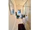 Well-maintained bathroom featuring a glass shower, vanity, and neutral decor at 273 Portofino Dr, North Venice, FL 34275