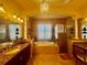 Luxurious bathroom with soaking tub, walk-in shower, granite counters, and elegant fixtures at 273 Portofino Dr, North Venice, FL 34275