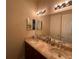 Bathroom with a marble countertop, double sinks, and multiple vanity lights at 273 Portofino Dr, North Venice, FL 34275