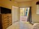 Bedroom with tile flooring and access to outdoor patio at 273 Portofino Dr, North Venice, FL 34275
