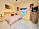 Comfortable bedroom with natural light and tile flooring at 273 Portofino Dr, North Venice, FL 34275