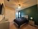 This bedroom boasts a modern bed, a TV, a ceiling fan, and closet for storage at 273 Portofino Dr, North Venice, FL 34275
