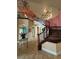 Grand foyer with high ceilings, decorative staircase, chandelier, and views to the formal living room at 273 Portofino Dr, North Venice, FL 34275