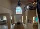 Bright foyer boasts high ceilings, arched window, tile floors, and access to multiple living spaces at 273 Portofino Dr, North Venice, FL 34275