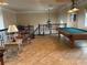 Game room with wrought iron stair railing, and a pool table at 273 Portofino Dr, North Venice, FL 34275
