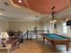 Game room with ornate ceiling and a pool table at 273 Portofino Dr, North Venice, FL 34275