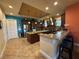 Well-equipped kitchen with dark wood cabinetry, granite countertops, and stainless steel appliances at 273 Portofino Dr, North Venice, FL 34275