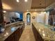 Large island kitchen with long countertops, stainless steel sink and plenty of cabinets at 273 Portofino Dr, North Venice, FL 34275