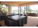 Large lanai features an outdoor kitchen and dining area with views of the scenic backyard at 273 Portofino Dr, North Venice, FL 34275
