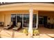 Inviting covered patio with lounge chairs, decorative plants, and views of the outdoors at 273 Portofino Dr, North Venice, FL 34275