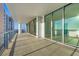 Wide balcony featuring floor-to-ceiling sliding glass doors and views of the surrounding area at 301 Quay Commons # 1411, Sarasota, FL 34236