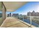 Spacious balcony featuring clear glass railings and beautiful city and ocean views at 301 Quay Commons # 1411, Sarasota, FL 34236