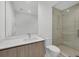 Contemporary bathroom featuring a sleek vanity with a marble countertop and walk-in glass shower at 301 Quay Commons # 1411, Sarasota, FL 34236