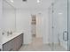Modern bathroom features sleek vanity, glass-enclosed shower, and contemporary fixtures at 301 Quay Commons # 1411, Sarasota, FL 34236