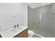 Modern bathroom featuring a glass shower, sleek fixtures, and marbled countertop at 301 Quay Commons # 1411, Sarasota, FL 34236