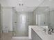 Modern bathroom with glass shower and sleek vanity with ample counter space at 301 Quay Commons # 1411, Sarasota, FL 34236