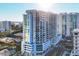 Exterior of a modern high-rise building featuring sleek design and multiple balconies at 301 Quay Commons # 1411, Sarasota, FL 34236