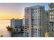 Modern condo building with balconies offers stunning views of the water and surrounding landscape at 301 Quay Commons # 1411, Sarasota, FL 34236