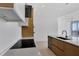 Modern kitchen with sleek island, pendant lights, and contemporary appliances at 301 Quay Commons # 1411, Sarasota, FL 34236