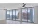 Spacious room features floor-to-ceiling glass windows providing abundant natural light and beautiful city views at 301 Quay Commons # 1411, Sarasota, FL 34236