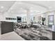 Bright resident lounge featuring comfortable seating, large windows, and modern decor at 301 Quay Commons # 1411, Sarasota, FL 34236
