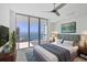 Serene bedroom with water views features a comfortable bed and stylish furnishings at 301 Quay Commons # 1411, Sarasota, FL 34236