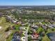 Bird's-eye view displaying a residential district with winding roads, serene lakes, and golf at 3336 Lakeside Cir, Parrish, FL 34219