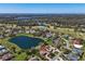 Expansive aerial view showcasing home near lake and golf course within the surrounding community at 3336 Lakeside Cir, Parrish, FL 34219