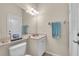 Bright bathroom with a vanity, mirror, and ample lighting, offering a clean and functional space at 3336 Lakeside Cir, Parrish, FL 34219