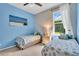 Bedroom with a cozy beach themed design and plenty of natural light at 3336 Lakeside Cir, Parrish, FL 34219
