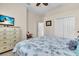 Comfortable bedroom featuring a TV, dresser, and closet for ample storage, providing a relaxing retreat at 3336 Lakeside Cir, Parrish, FL 34219