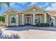 Beautiful front entrance with decorative columns and double glass doors at 3336 Lakeside Cir, Parrish, FL 34219