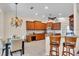 Kitchen area featuring bar stool seating, recessed lighting, eat in area and wood cabinetry at 3336 Lakeside Cir, Parrish, FL 34219