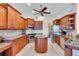 Well-lit kitchen with wood cabinets, stainless steel appliances, and granite countertops at 3336 Lakeside Cir, Parrish, FL 34219