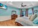 Large main bedroom with hardwood floors and access to the pool at 3336 Lakeside Cir, Parrish, FL 34219